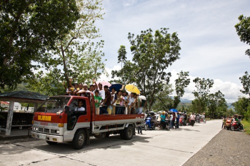 Funeral procession - Phillipines style. We got cheered and waved as we rode past this happy bunch. We were surprised how many funerals we saw - but in a country of 90 million people you are bound to see a few! 